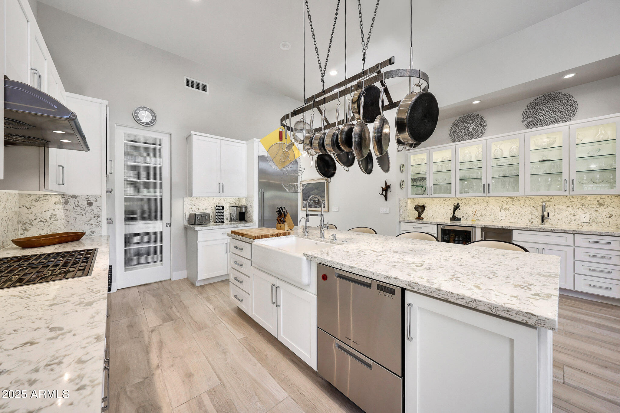 9850 East McDowell Mountain Ranch Road, Unit 1019 Scottsdale, AZ 85260 - Photo 13 of 66 a kitchen with a sink a stove and cabinets