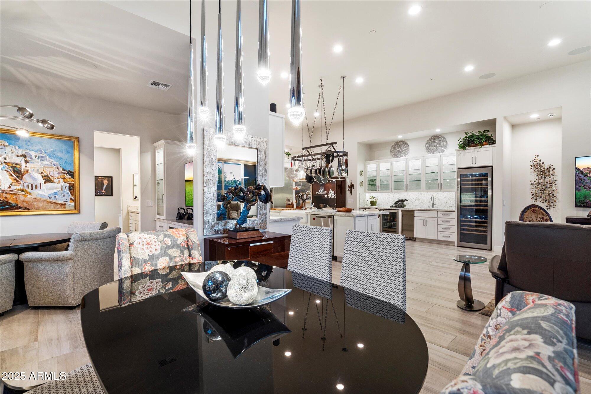 9850 East McDowell Mountain Ranch Road, Unit 1019 Scottsdale, AZ 85260 - Photo 16 of 66 a kitchen with stainless steel appliances kitchen island granite countertop a stove and white cabinets