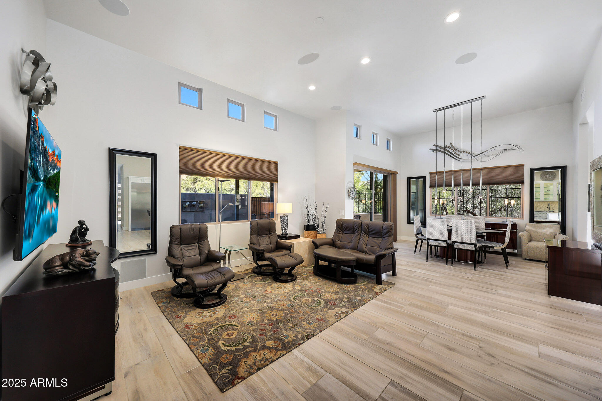 9850 East McDowell Mountain Ranch Road, Unit 1019 Scottsdale, AZ 85260 - Photo 21 of 66 a living room with furniture large window and flat screen tv
