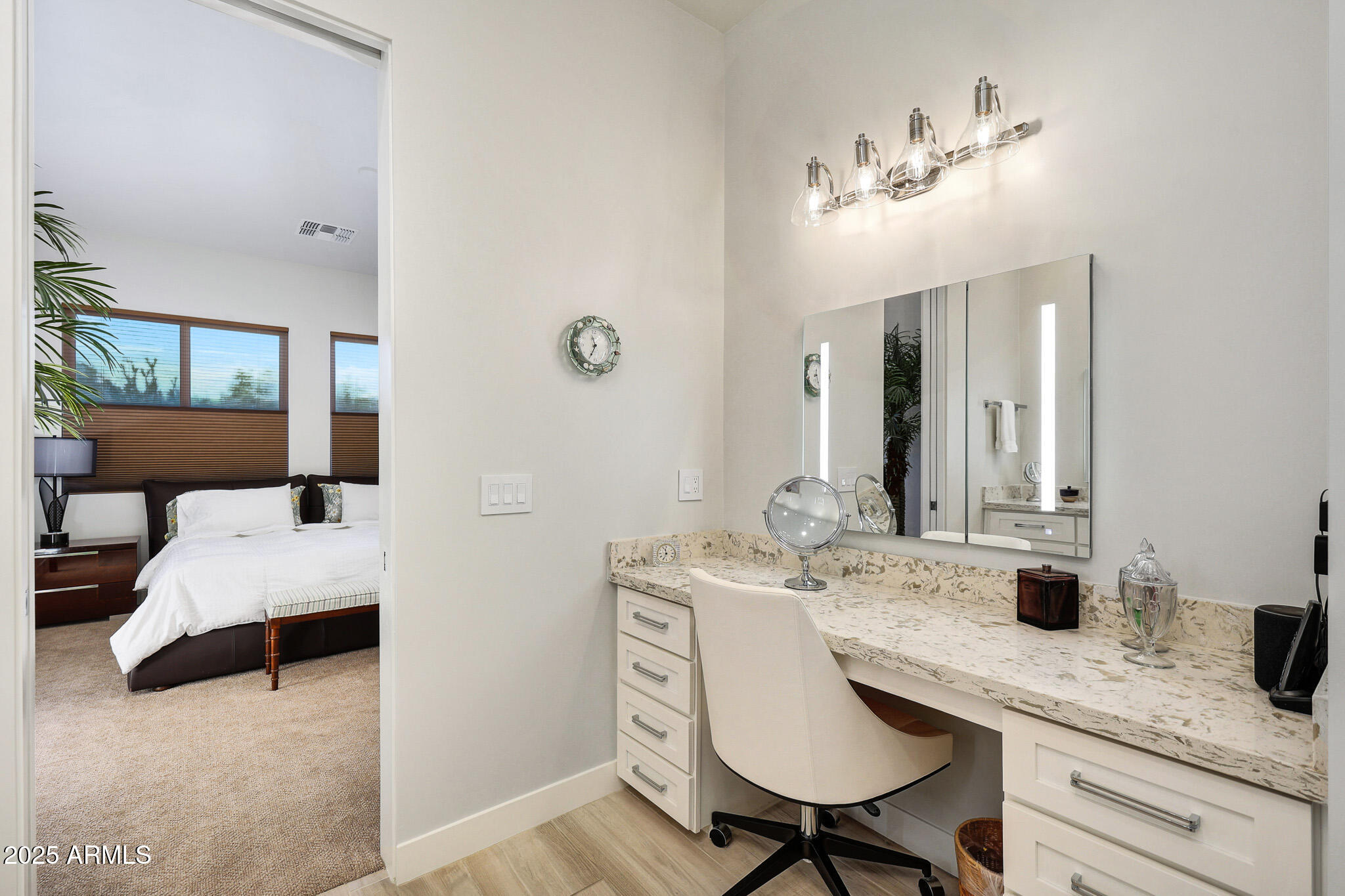9850 East McDowell Mountain Ranch Road, Unit 1019 Scottsdale, AZ 85260 - Photo 34 of 66 a en suite bathroom with a granite countertop sink and a mirror