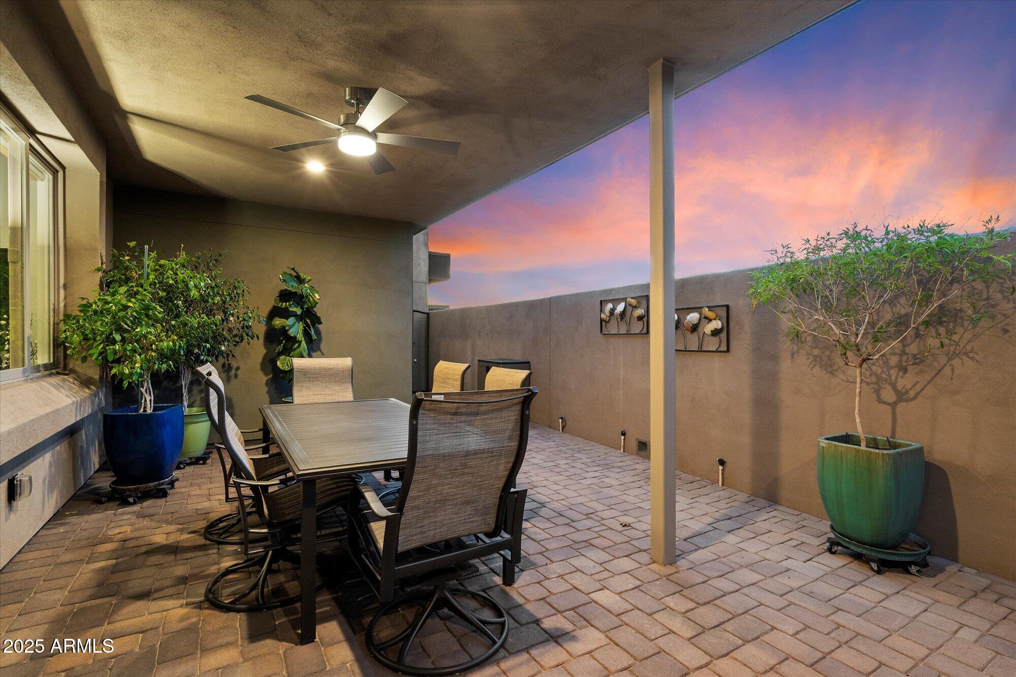 9850 East McDowell Mountain Ranch Road, Unit 1019 Scottsdale, AZ 85260 - Photo 46 of 66 a view of a dining room with furniture and a potted plant