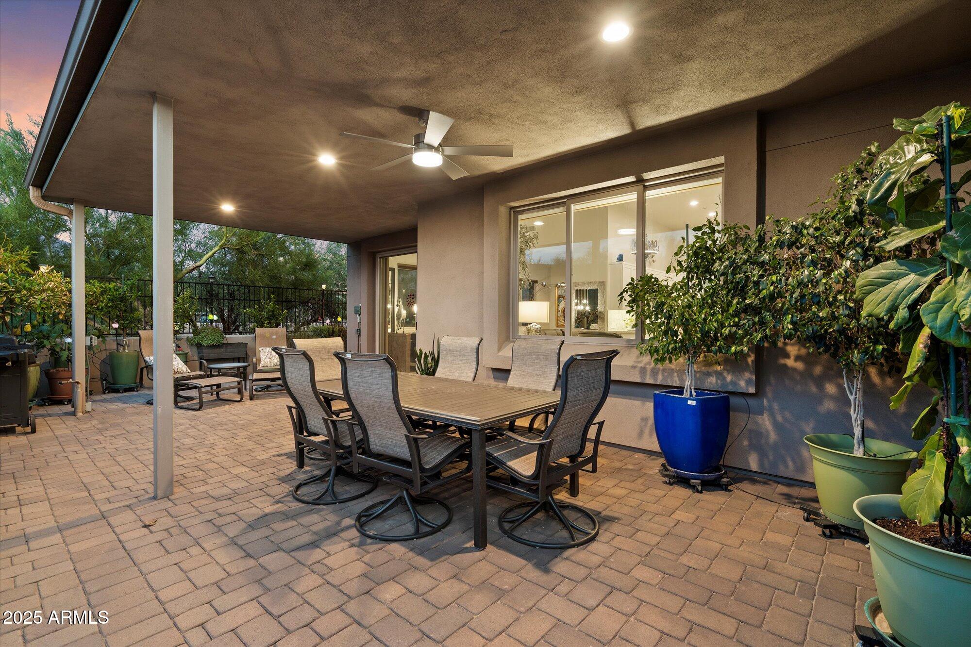 9850 East McDowell Mountain Ranch Road, Unit 1019 Scottsdale, AZ 85260 - Photo 47 of 66 a view of a dining room with furniture and chandelier