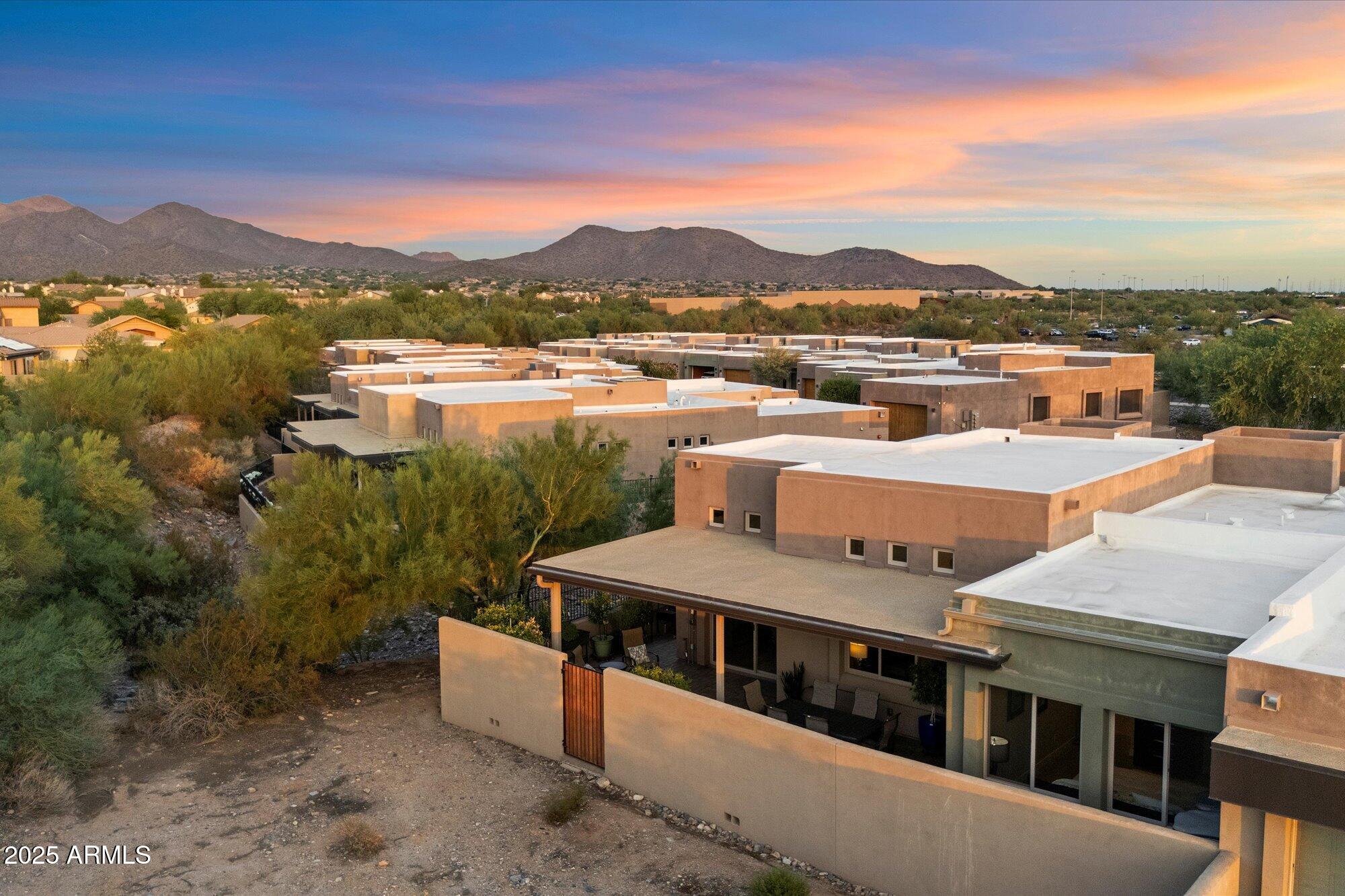 9850 East McDowell Mountain Ranch Road, Unit 1019 Scottsdale, AZ 85260 - Photo 56 of 66 a terrace with outdoor seating and city view