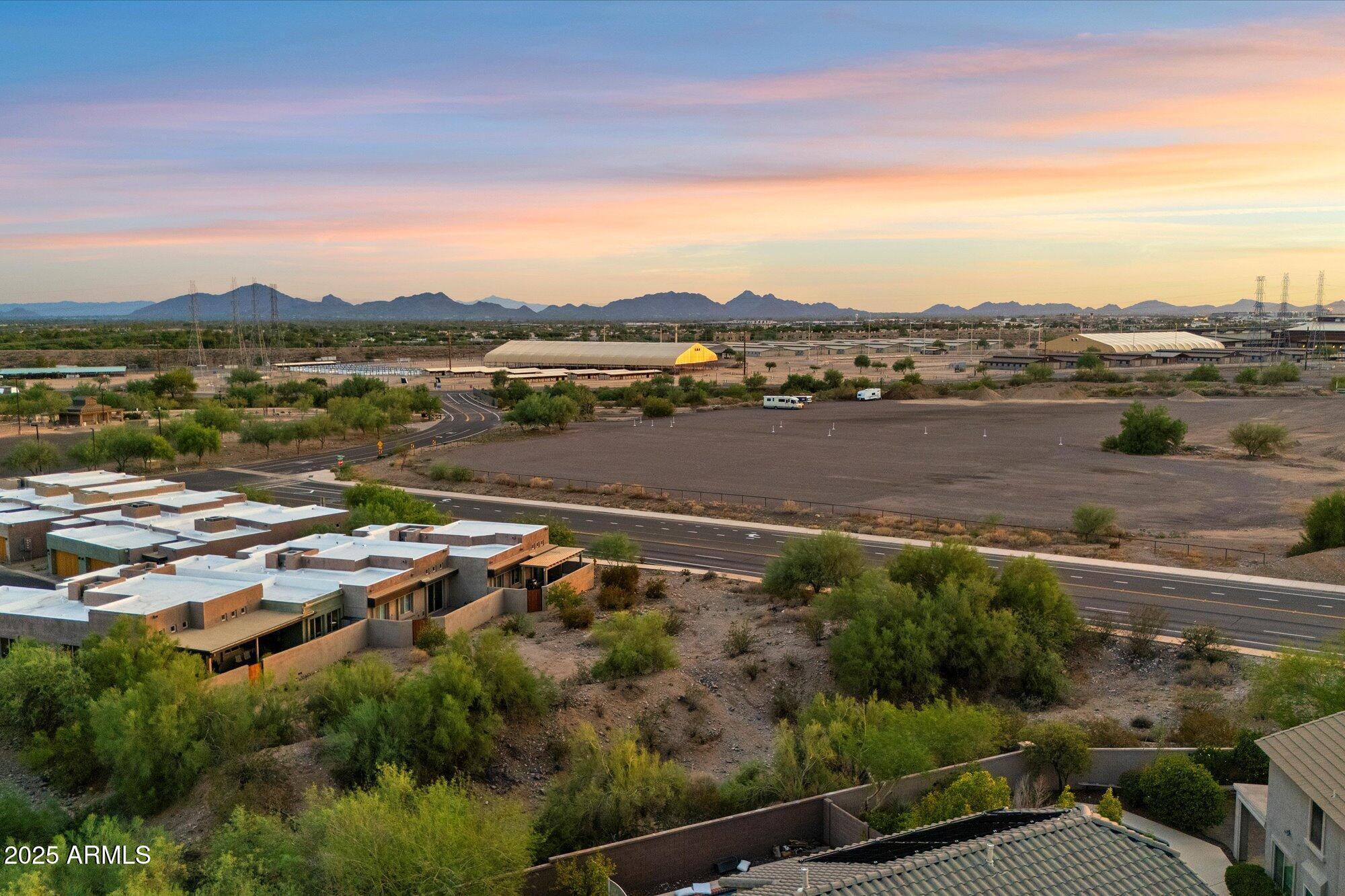 9850 East McDowell Mountain Ranch Road, Unit 1019 Scottsdale, AZ 85260 - Photo 59 of 66 an aerial view of residential building with outdoor space lake and green space