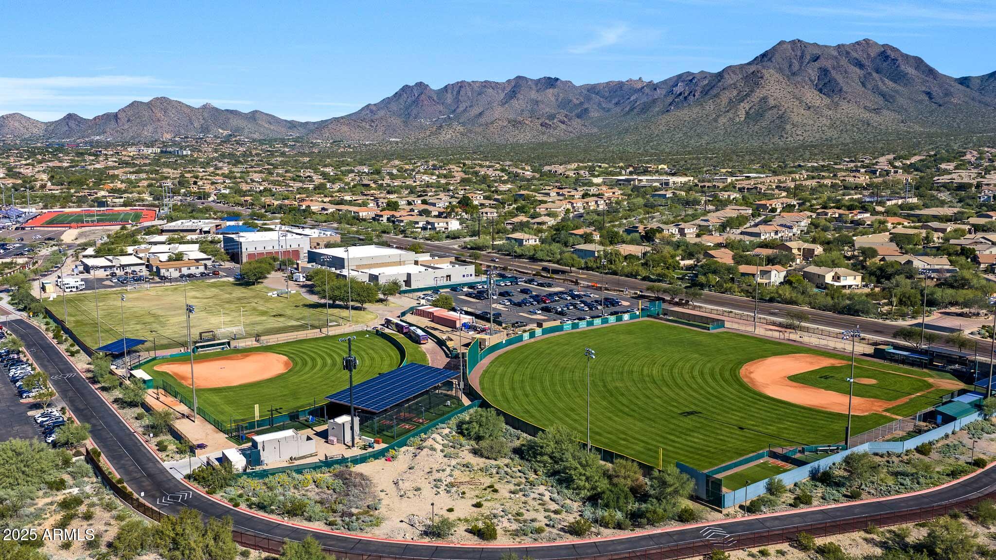 9850 East McDowell Mountain Ranch Road, Unit 1019 Scottsdale, AZ 85260 - Photo 62 of 66 an aerial view of a house a mountain and a garden