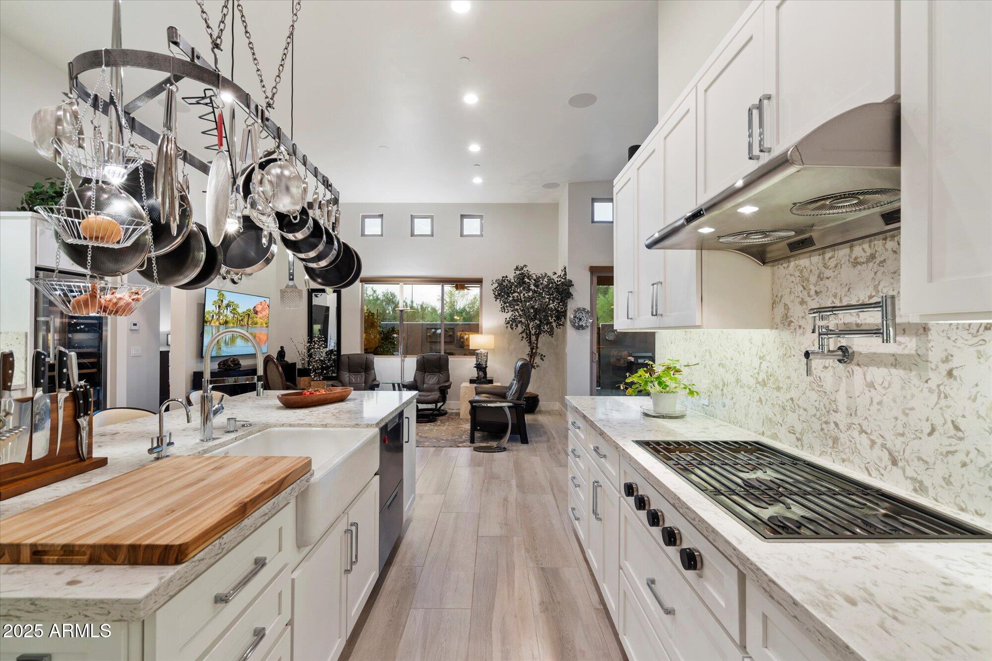9850 East McDowell Mountain Ranch Road, Unit 1019 Scottsdale, AZ 85260 - Photo 7 of 66 a kitchen with stainless steel appliances granite countertop a lot of counter space
