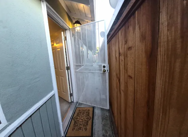 a bathroom with a mirror and a shower