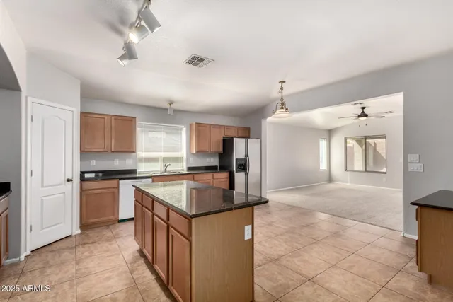 a kitchen with a stove sink and refrigerator