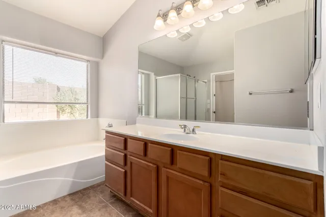 a white bath tub sitting next to a window