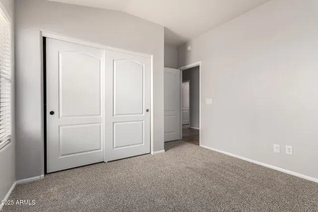 a bathroom with a sink toilet vanity and shower