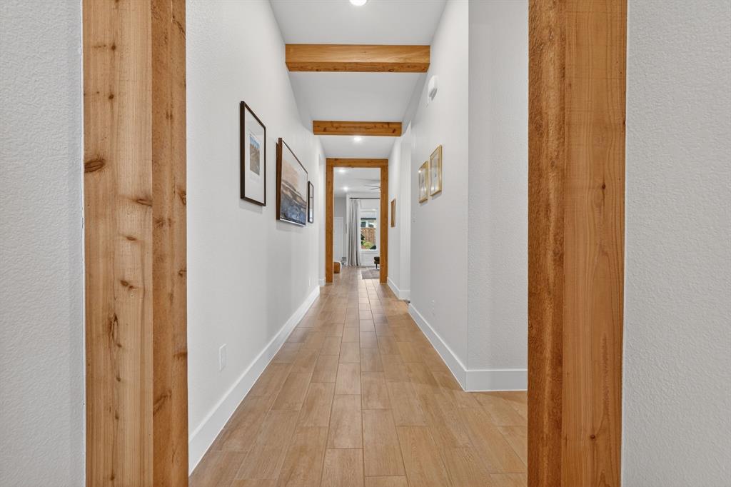 7117 Mantle Ridge Drive Fort Worth, TX 76179 - Photo 32 of 38 a view of a hallway with wooden floor and entryway