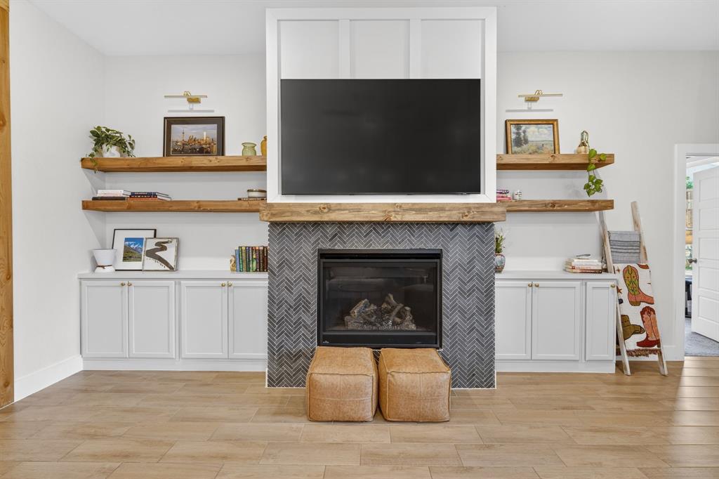7117 Mantle Ridge Drive Fort Worth, TX 76179 - Photo 8 of 38 a living room with furniture and a fireplace