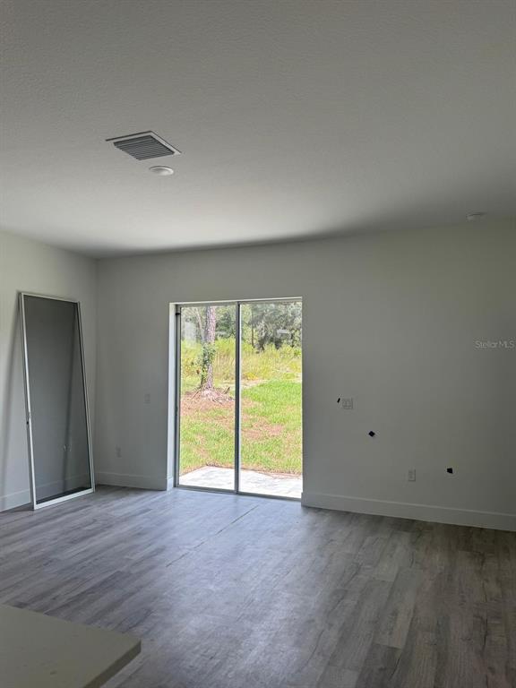 9187 North Travis Drive, Unit 9189 Citrus Springs, FL 34434 - Photo 13 of 21 a view of an empty room with a window