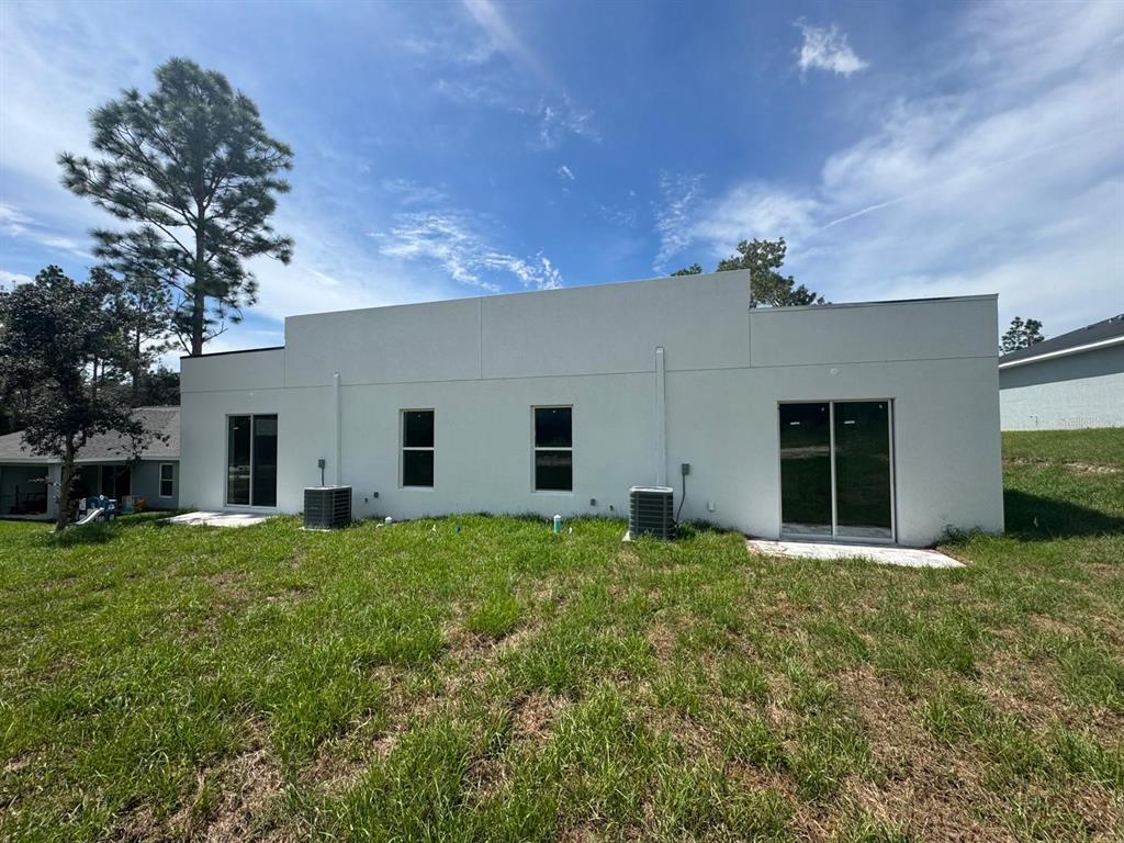 9187 North Travis Drive, Unit 9189 Citrus Springs, FL 34434 - Photo 21 of 21 a house view with a garden space