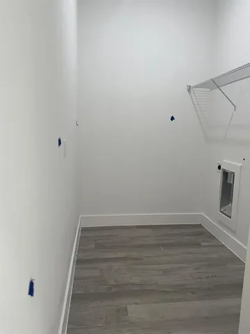 a kitchen with a sink cabinets and a window