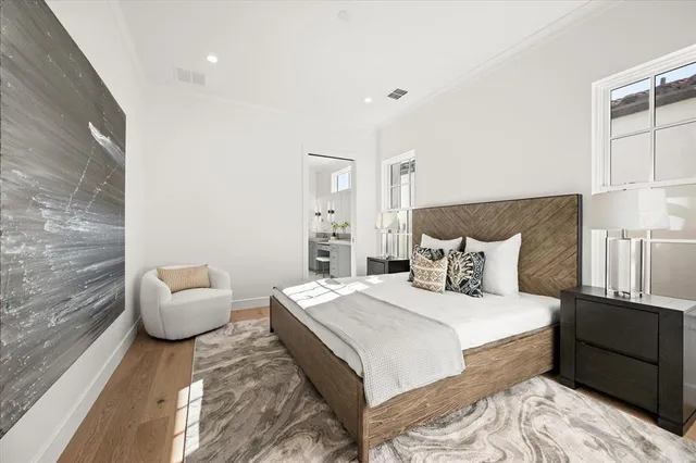 a bedroom with a bed and a couch