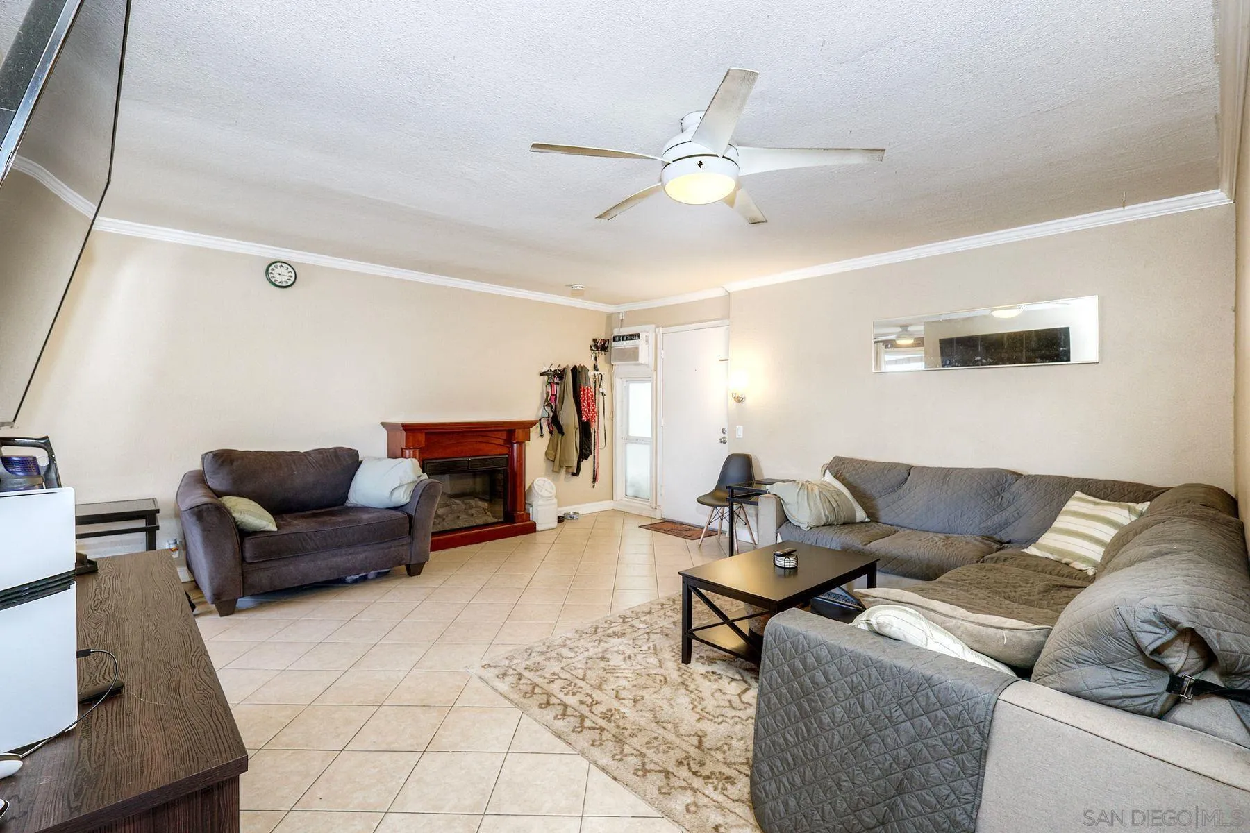12923 Mapleview Street, Unit 6 Lakeside, CA 92040 - Photo 10 of 25 a living room with furniture and a chandelier