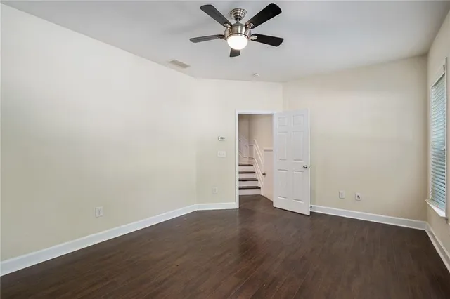 a view of an empty room and wooden floor