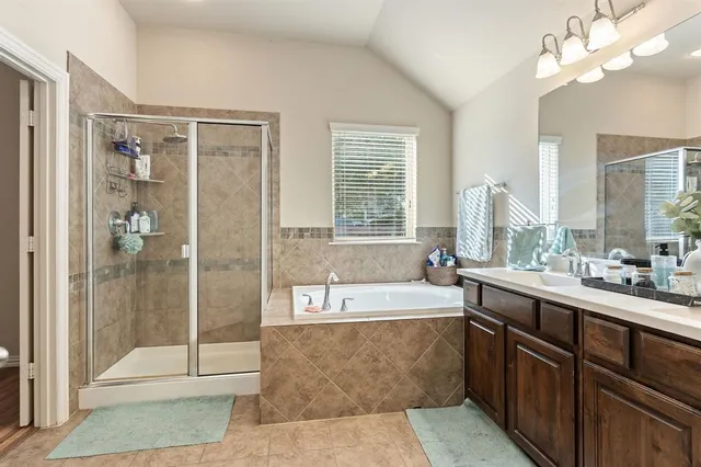 a large kitchen with a large window and stainless steel appliances