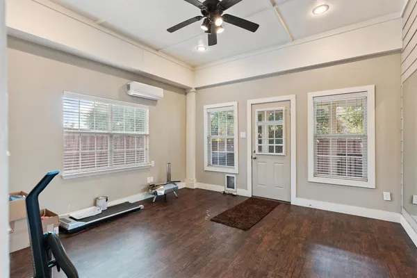 a living room with a bed furniture and a window