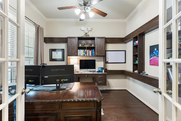 a room with kitchen island granite countertop furniture and a flat screen tv