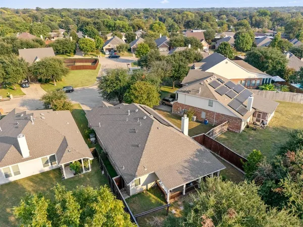 an aerial view of residential houses with outdoor space