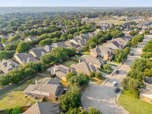 an aerial view of residential houses with outdoor space