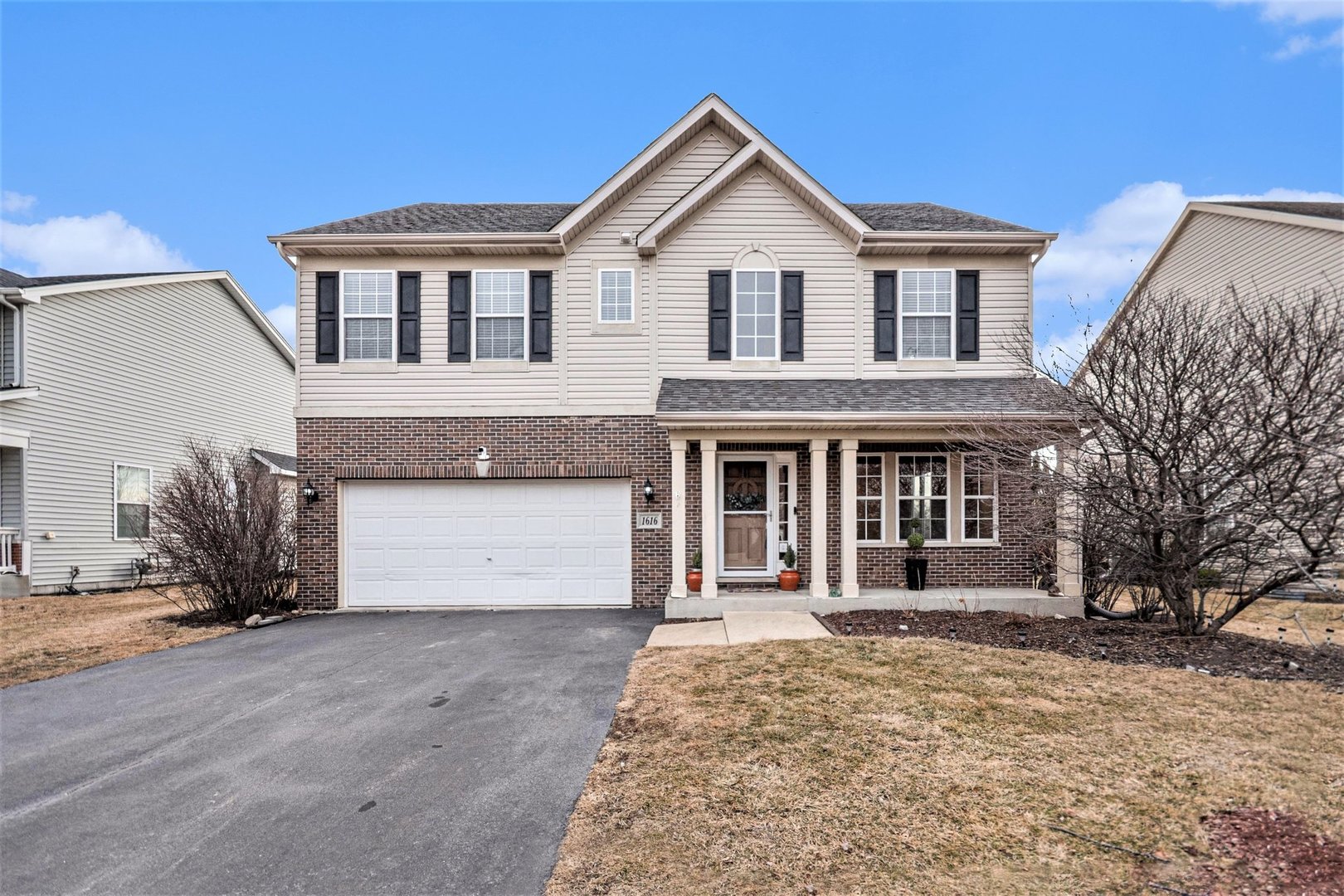 1616 Stanton Lane Plainfield, IL 60586 - Photo 1 of 40 a front view of a house with a yard and garage