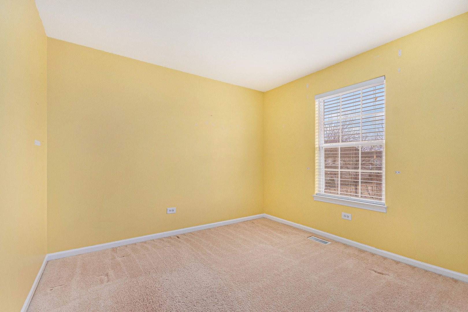 1616 Stanton Lane Plainfield, IL 60586 - Photo 15 of 40 a view of an empty room with a window