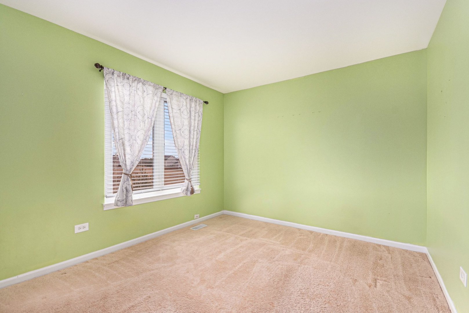 1616 Stanton Lane Plainfield, IL 60586 - Photo 17 of 40 a view of an empty room with a window