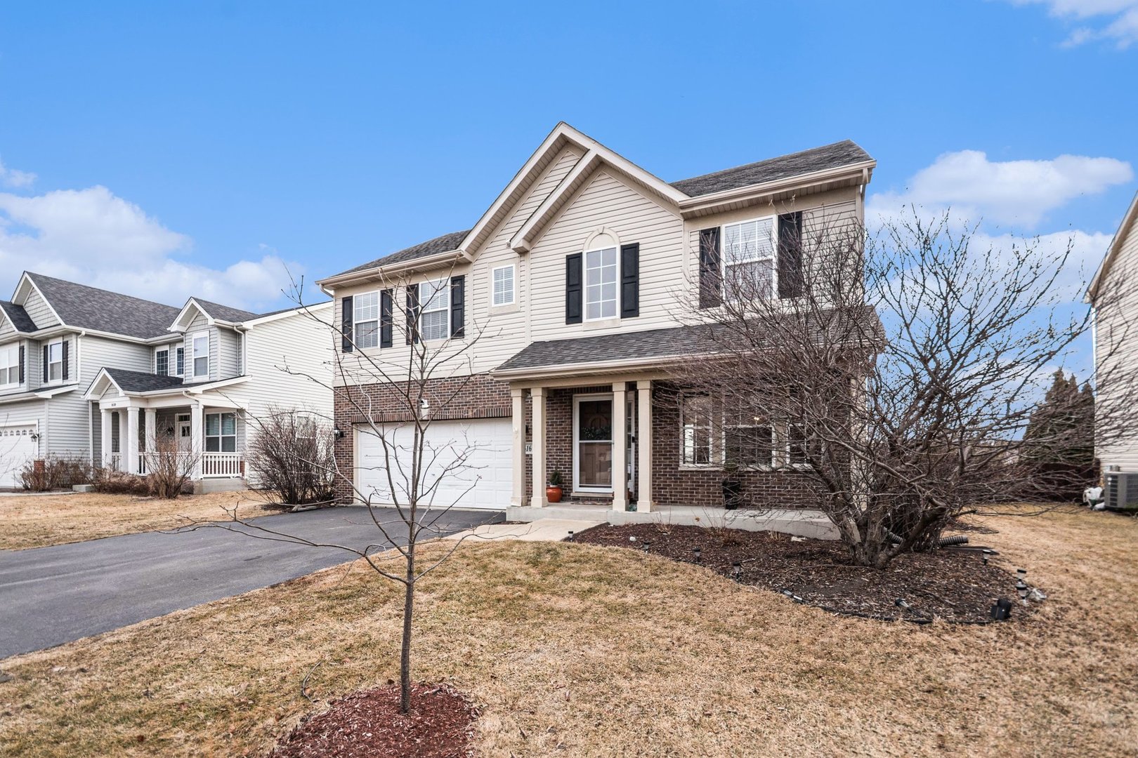 1616 Stanton Lane Plainfield, IL 60586 - Photo 2 of 40 a front view of a house with a yard
