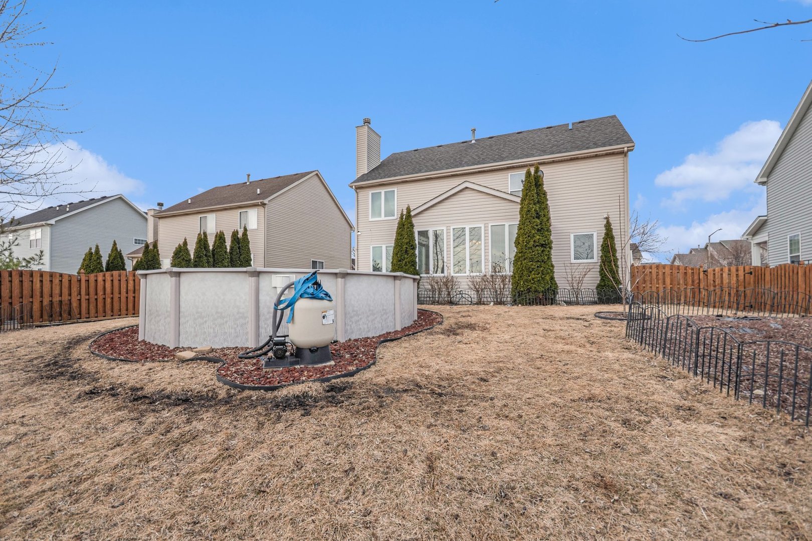 1616 Stanton Lane Plainfield, IL 60586 - Photo 22 of 40 a view of backyard with a small cabin and wooden fence