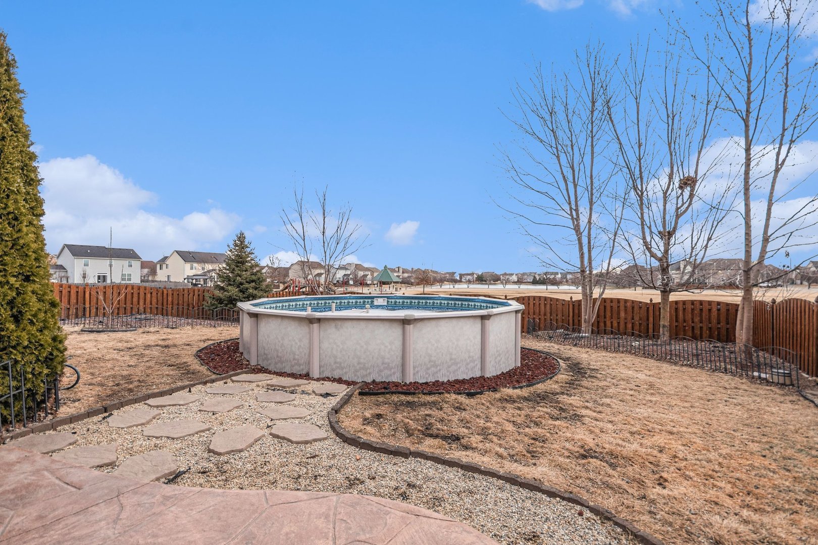 1616 Stanton Lane Plainfield, IL 60586 - Photo 23 of 40 a view of a dry yard with wooden fence