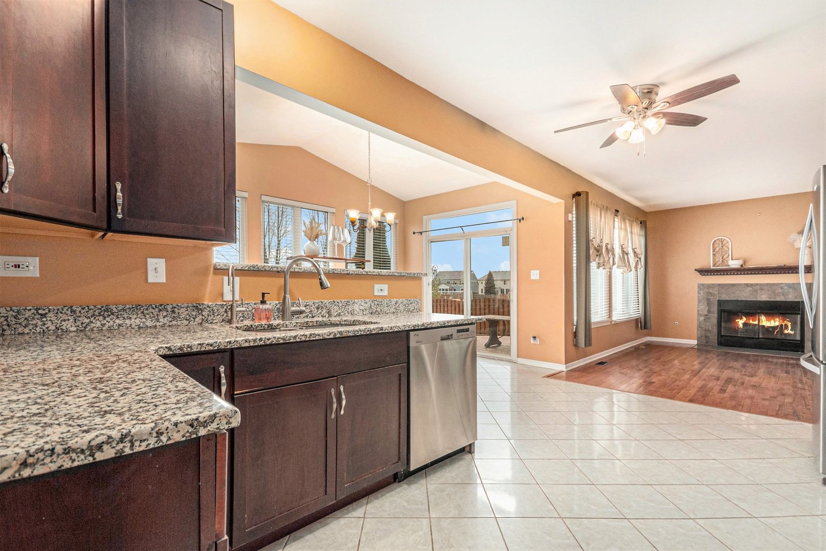 1616 Stanton Lane Plainfield, IL 60586 - Photo 10 of 40 a kitchen with kitchen island granite countertop a sink and a stove