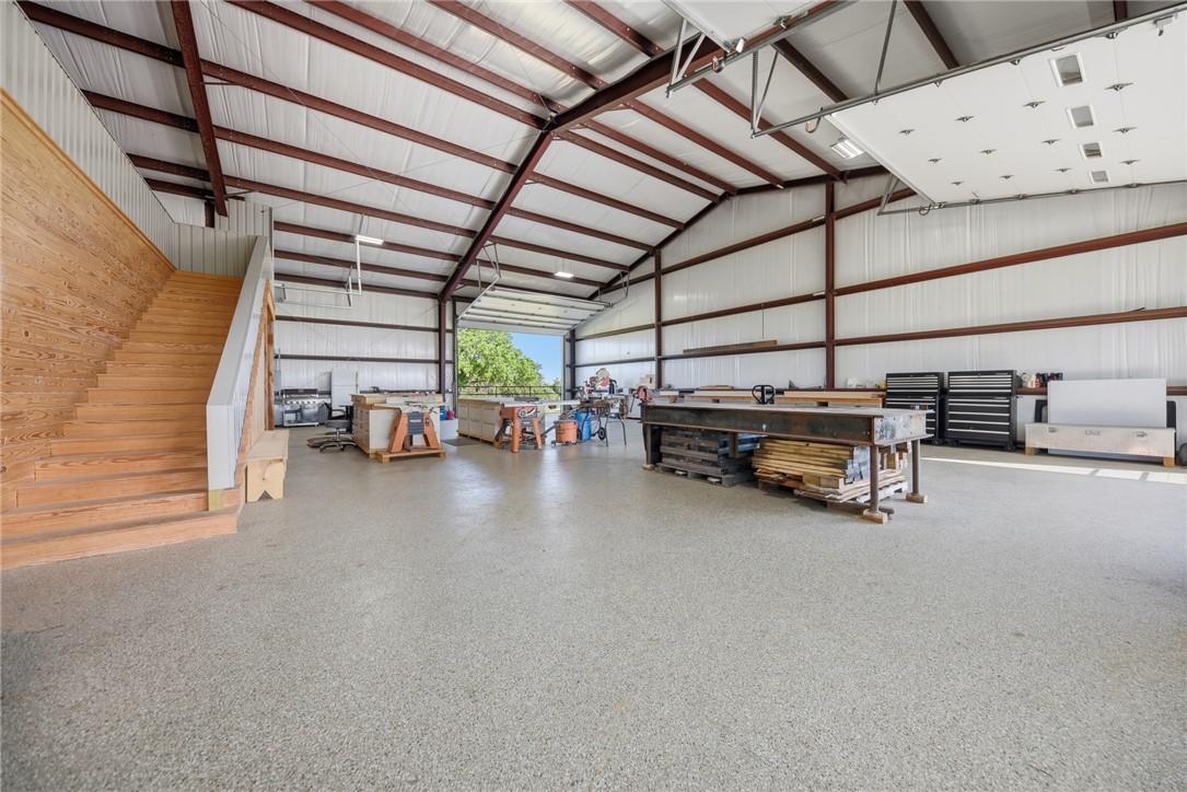 126 South Berlin Road Brenham, TX 77833 - Photo 24 of 30 a view of storage and utility room with racks