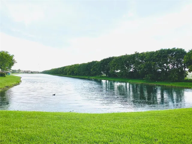 a view of a lake with a big yard