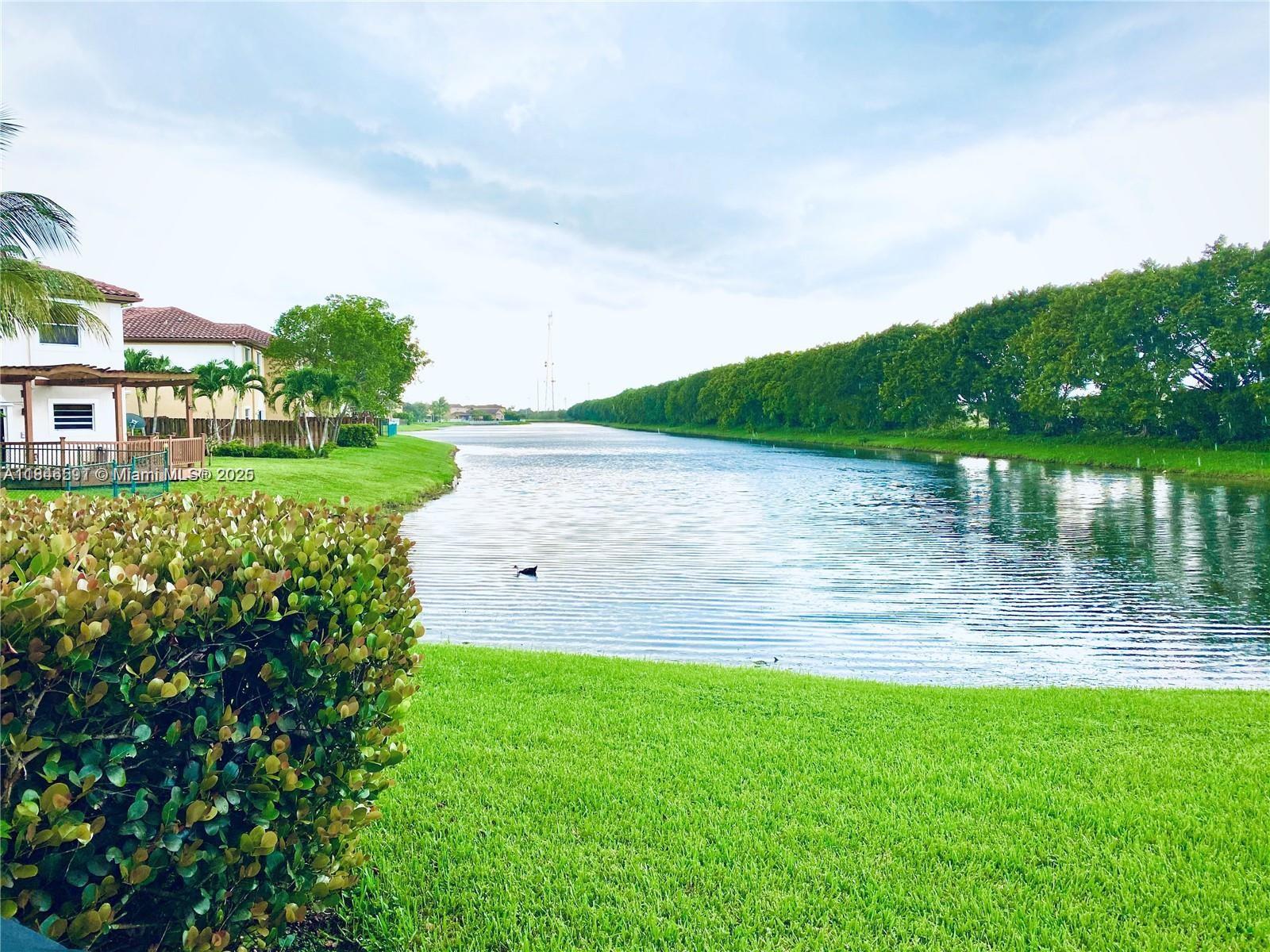 4908 Southwest 141st Avenue, Unit 3 Miramar, FL 33027 - Photo 14 of 29 a view of a lake with a big yard
