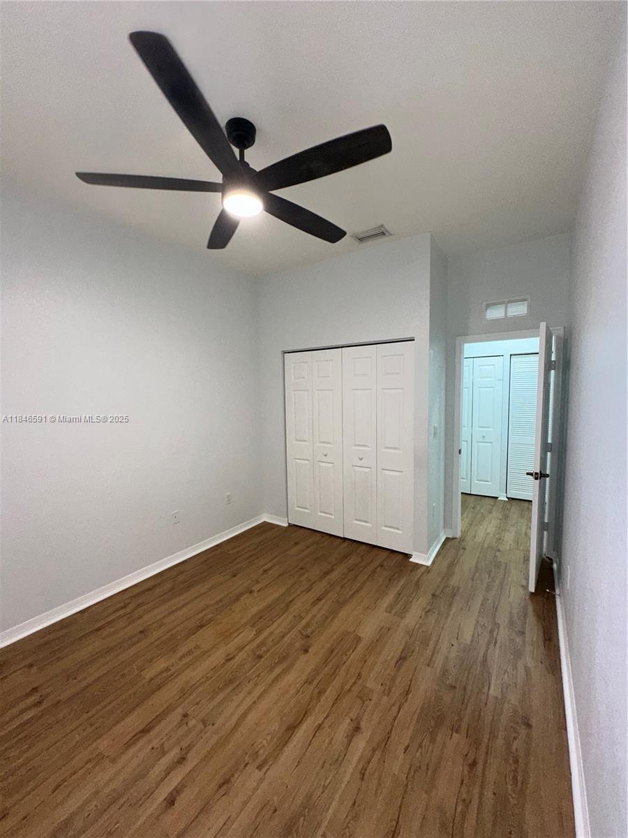 4908 Southwest 141st Avenue, Unit 3 Miramar, FL 33027 - Photo 19 of 29 wooden floor in an empty room