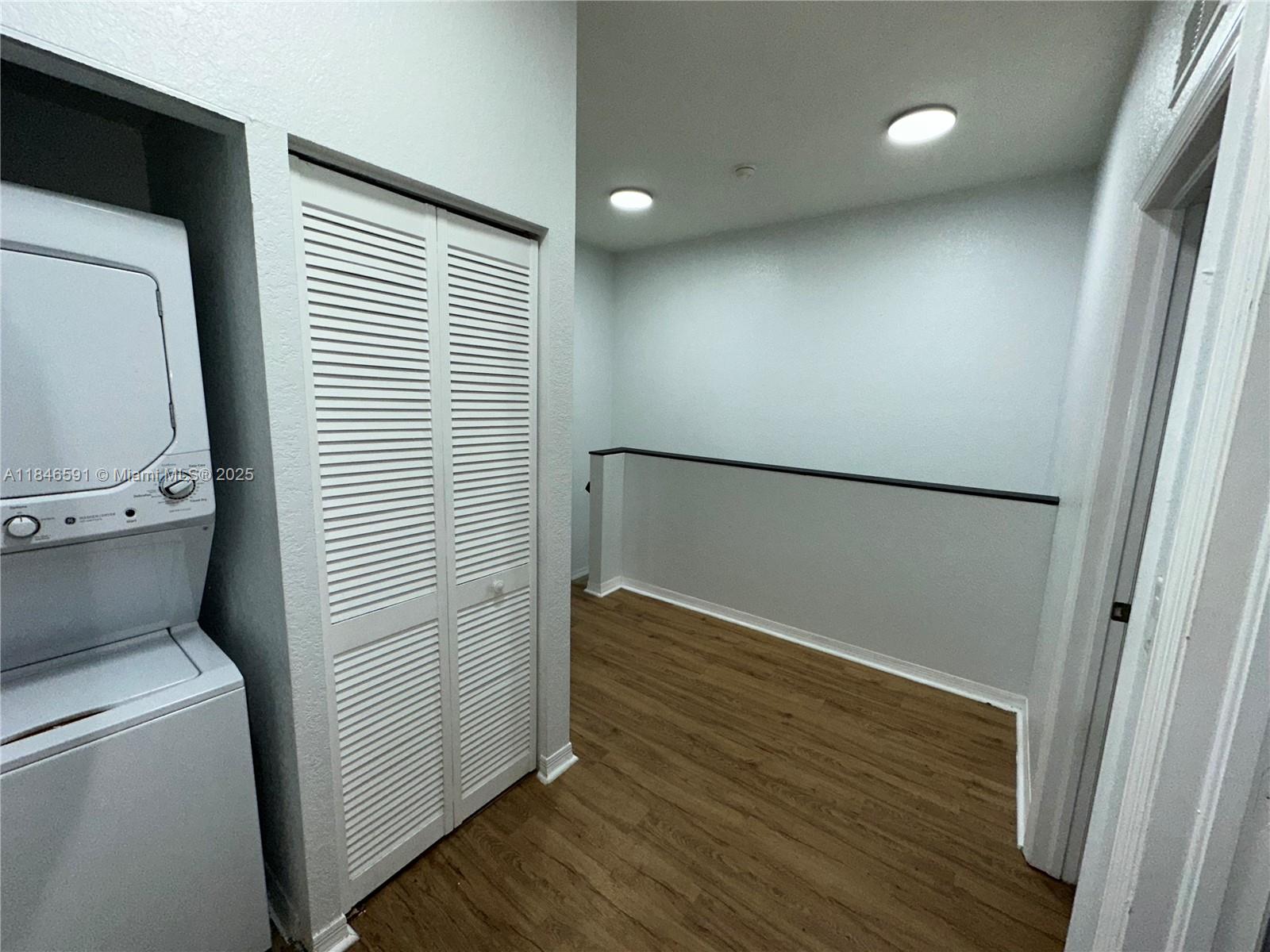 4908 Southwest 141st Avenue, Unit 3 Miramar, FL 33027 - Photo 21 of 29 a view of storage and utility room with wooden floor