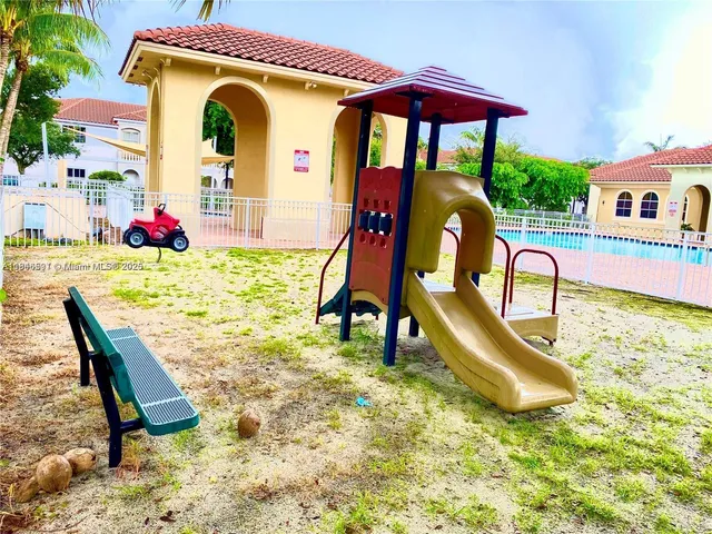 a view of a park with palm trees