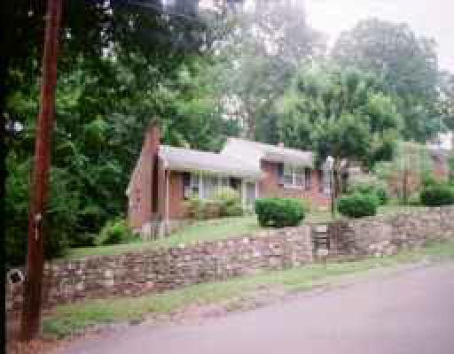 3426 Wedgewood Road Southwest Roanoke, VA 24018 - Photo 1 of 1 a front view of a house with a garden and trees