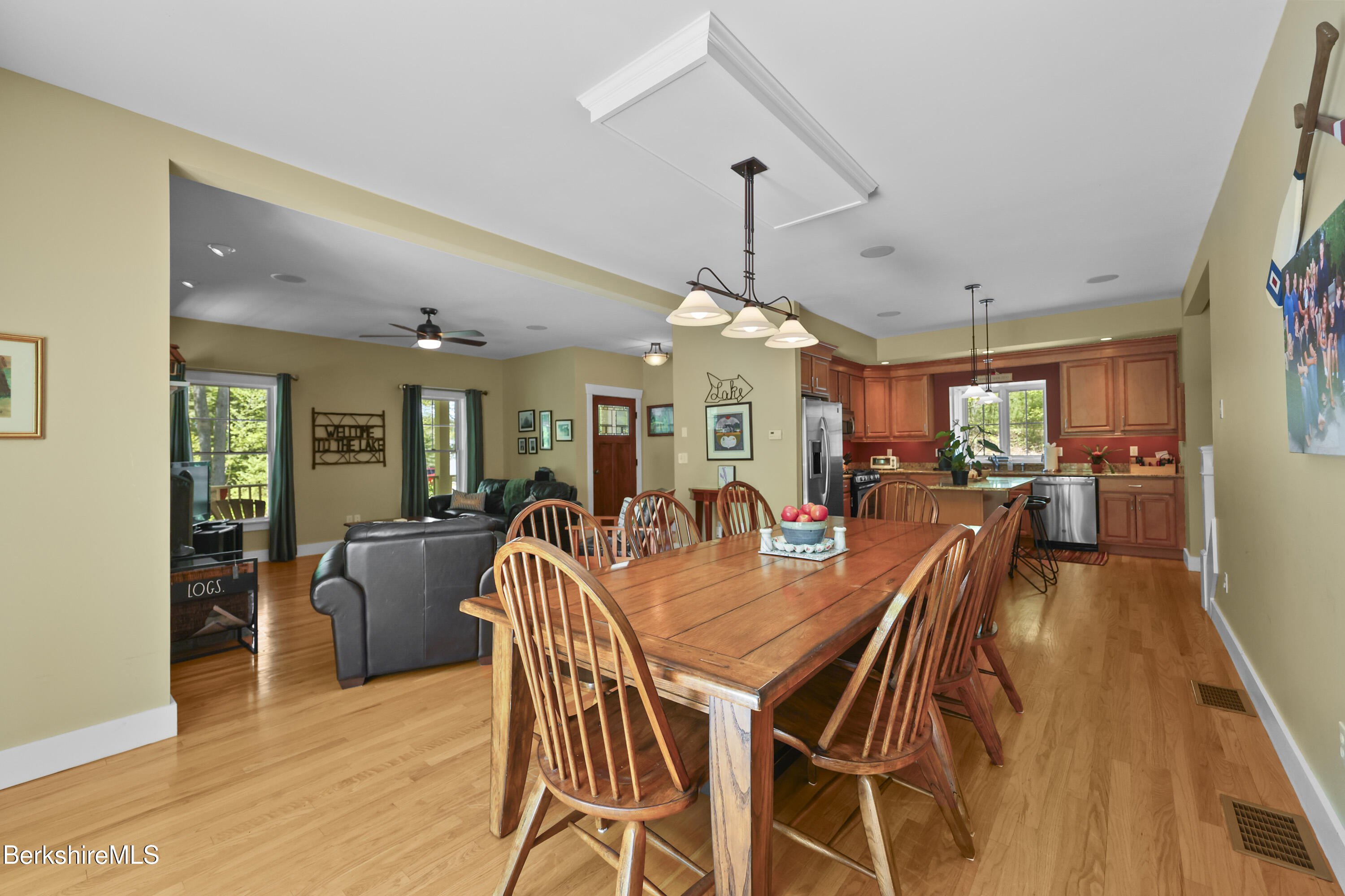 157 Pike Road Otis, MA 01029 - Photo 23 of 59 a dining room with furniture a chandelier and wooden floor