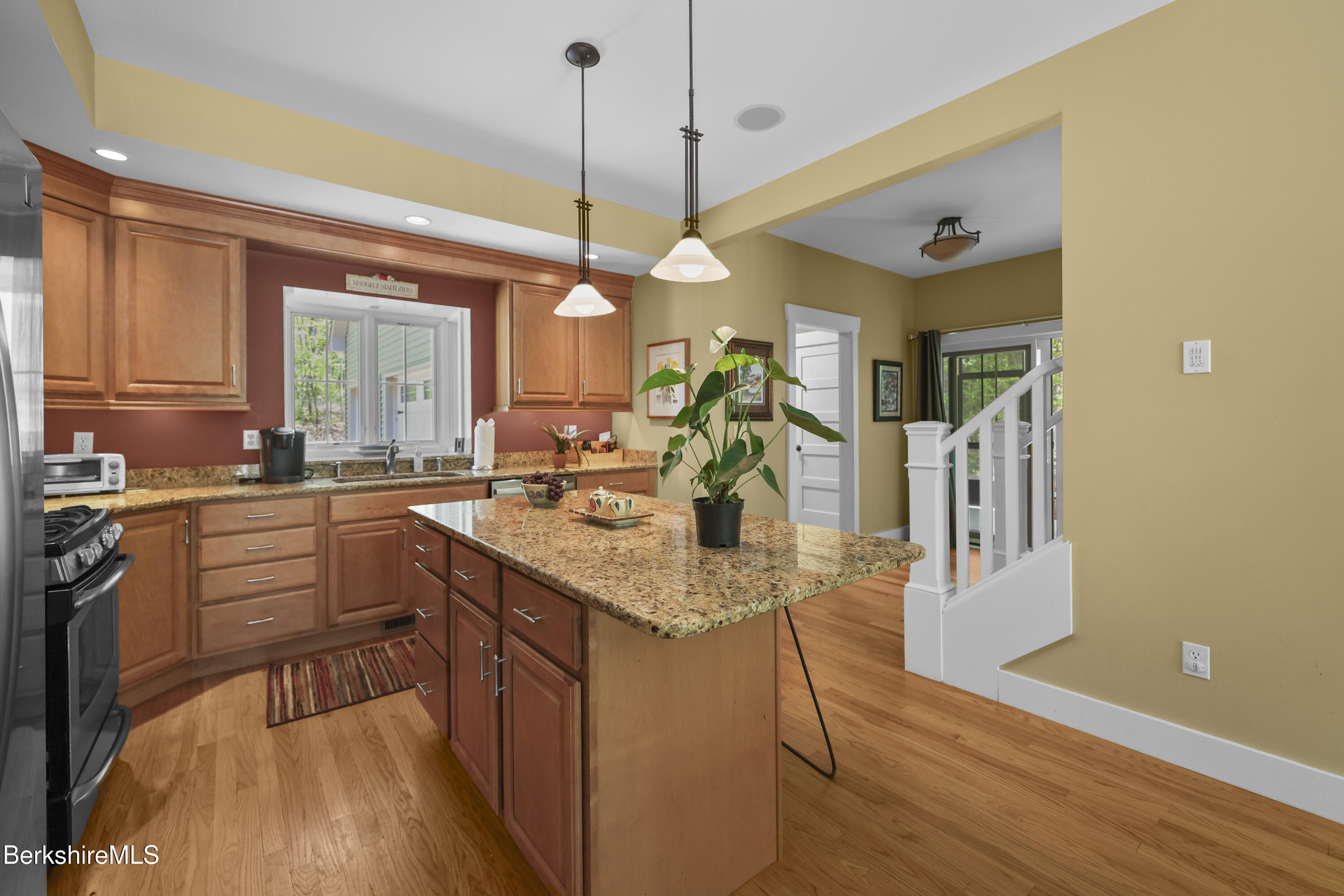 157 Pike Road Otis, MA 01029 - Photo 26 of 59 a kitchen with stainless steel appliances granite countertop a sink a stove and a wooden floors