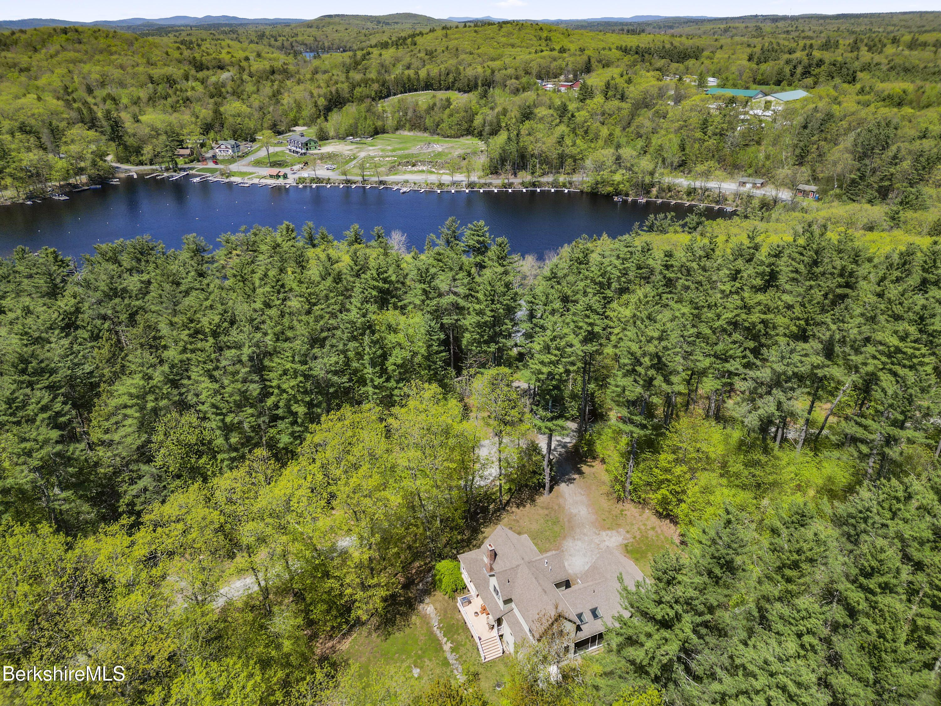 157 Pike Road Otis, MA 01029 - Photo 3 of 59 an aerial view of a houses with a lake view
