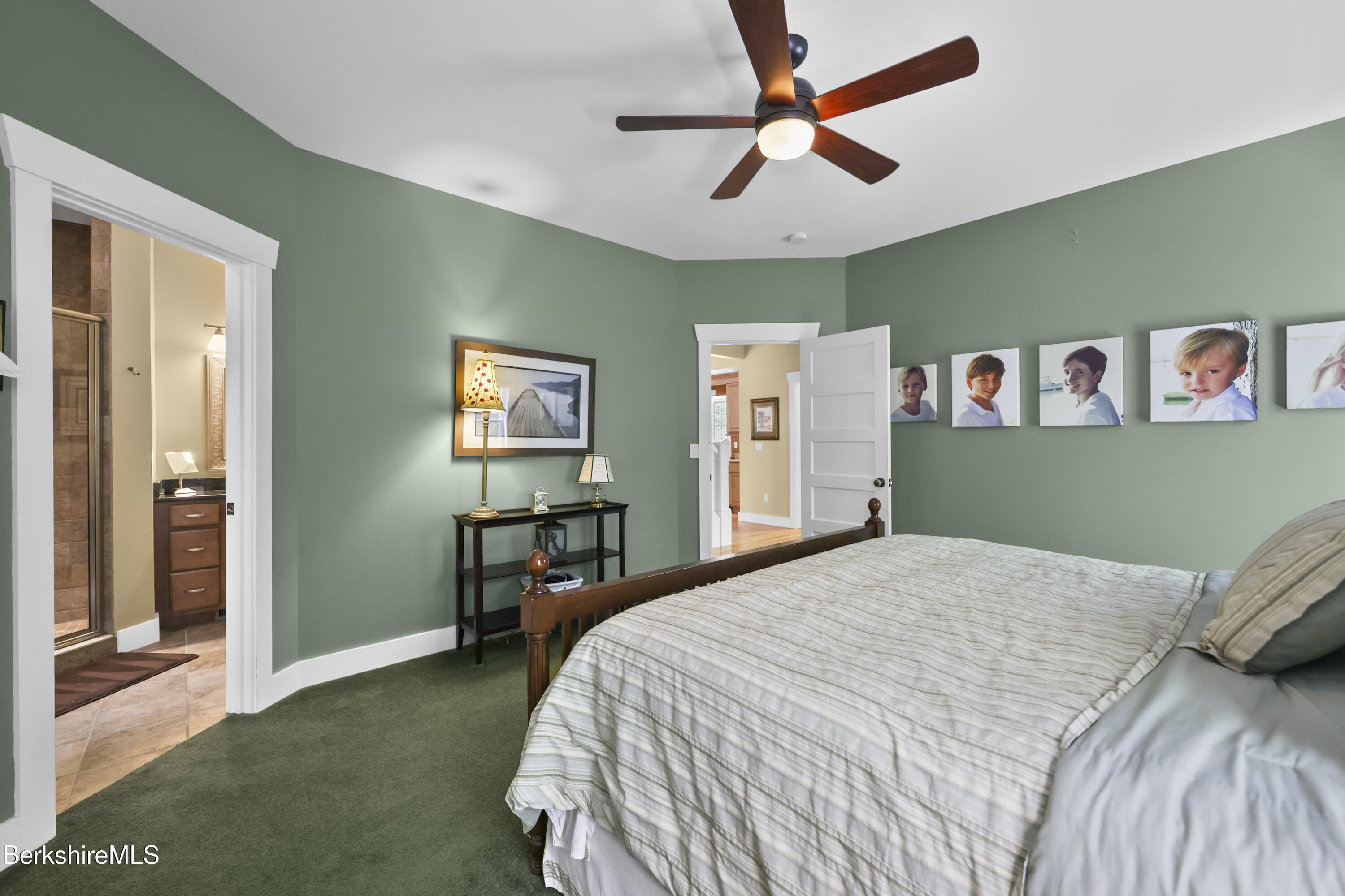 157 Pike Road Otis, MA 01029 - Photo 34 of 59 a bedroom with a bed and a chandelier