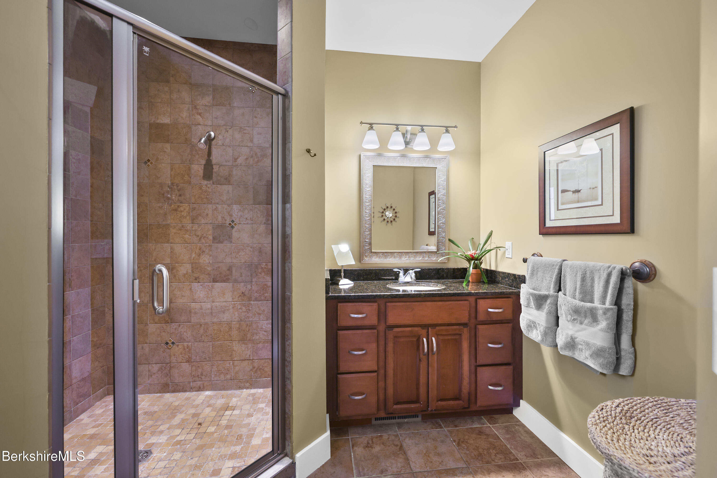157 Pike Road Otis, MA 01029 - Photo 35 of 59 a bathroom with a granite countertop sink a mirror and a shower