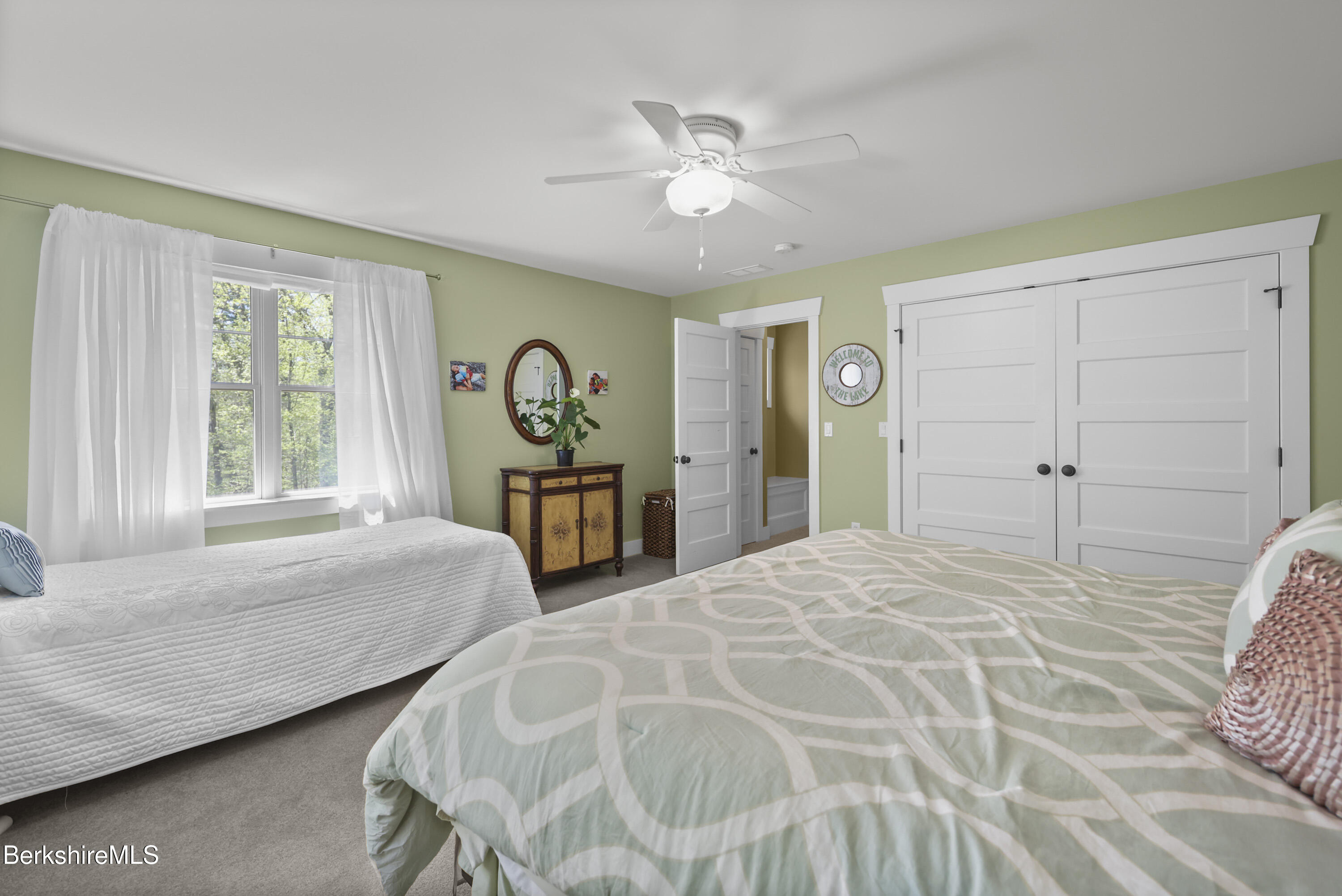 157 Pike Road Otis, MA 01029 - Photo 45 of 59 a spacious bedroom with two beds and a window