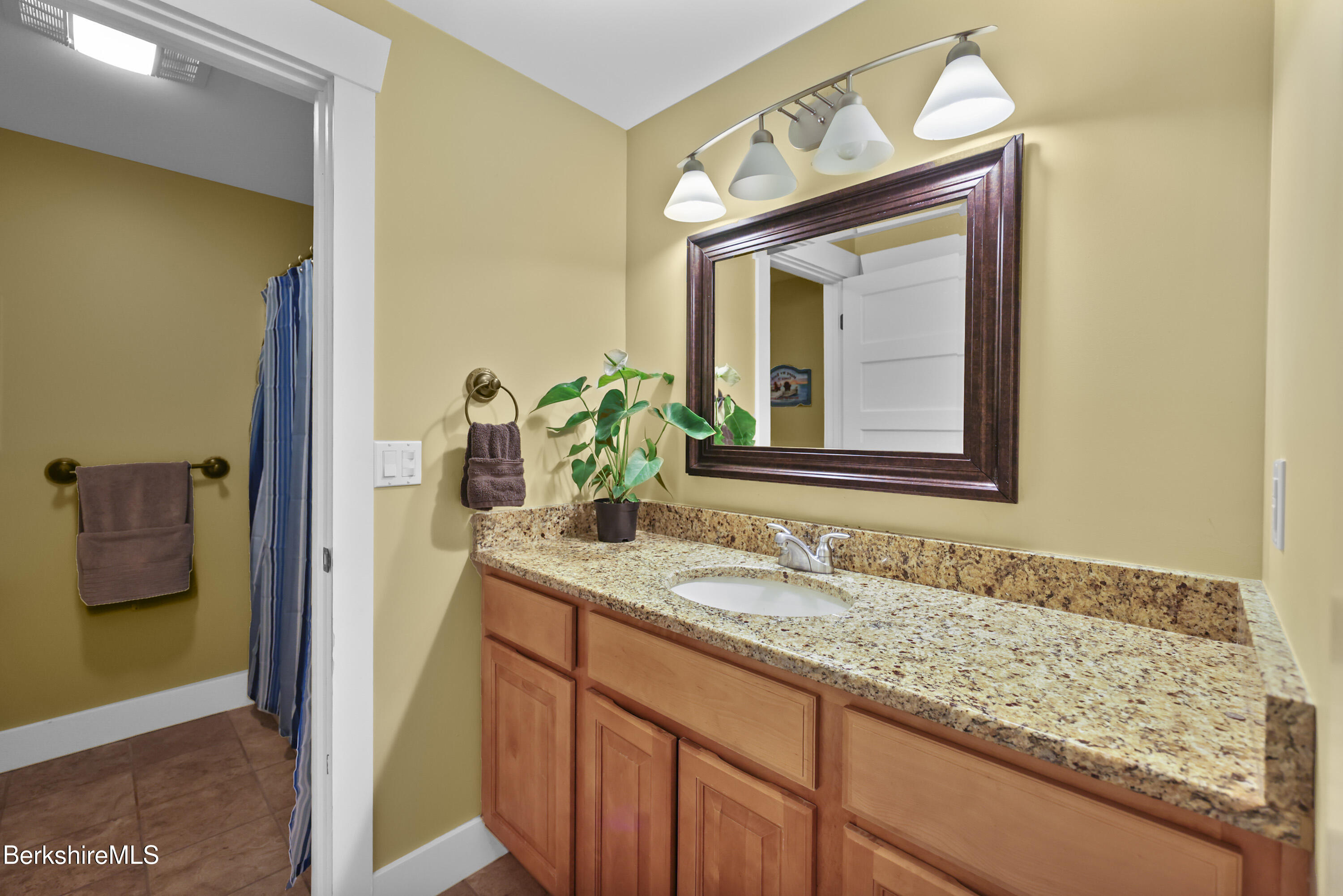 157 Pike Road Otis, MA 01029 - Photo 54 of 59 a bathroom with a granite countertop sink and a mirror