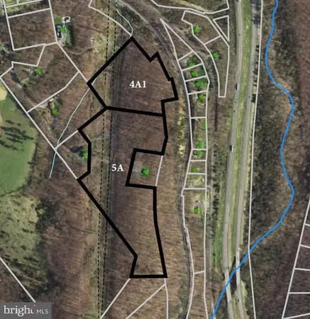 a view of a balcony with wooden floor and fence