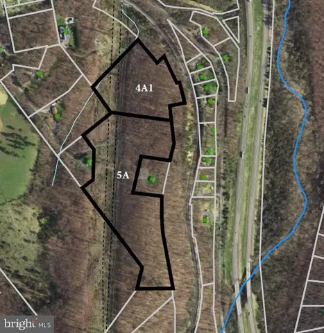 a view of a balcony with wooden floor and fence